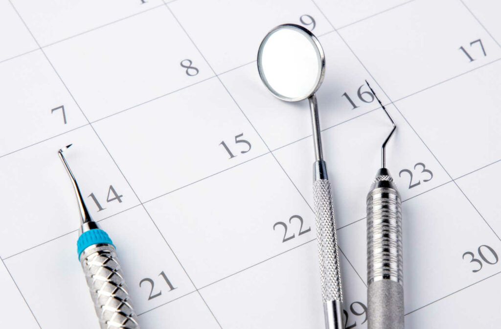 Dental tools placed on a calendar.