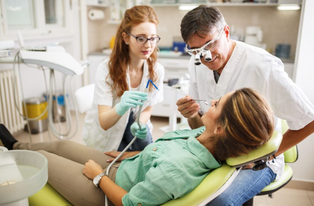 Dentist and hygienist with patient.