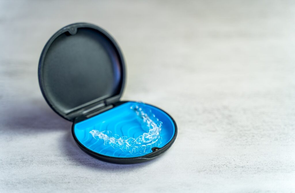 Invisalign aligners sitting in their case.